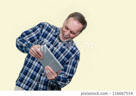 Happy expressive aged man playing video game on tablet pc. Isolated on white background. 116667554