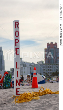 Sign on the beach in Miami Beach. Summer afternoon at the beach Sign on the beach in Miami Beach. Summer afternoon at the beach 116667836