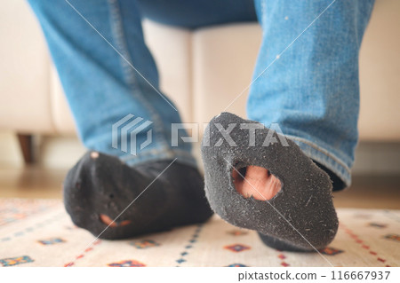 men feet with dirty socks while sitting on sofa men feet with dirty socks while sitting on sofa 116667937