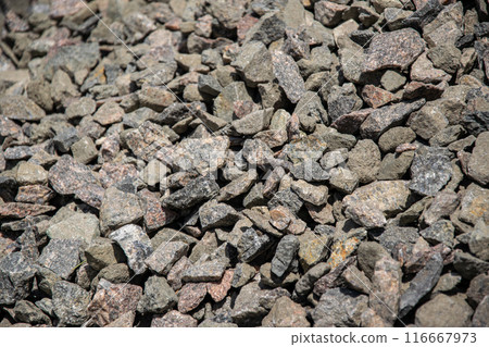 A close up view of a pile of gray crushed stone gravel A close up view of a pile of gray crushed stone gravel 116667973