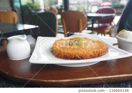 Turkish dessert kunefe, kunafa, kadayif with pistachio  116668186