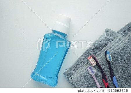 mouthwash liquid in a container on table  116668256