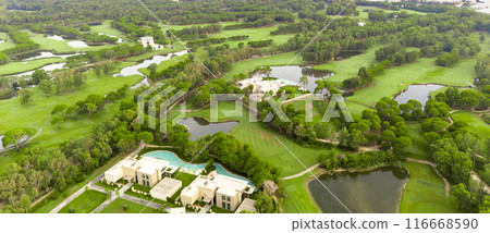 Aerial view of golf course and luxury villas in Belek, Turkey. Concept of upscale living and recreational facilities Aerial view of golf course and luxury villas in Belek, Turkey. Concept of upscale living and recreational facilities 116668590