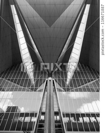 Modern architectural building with geometric design and reflections Modern architectural building with geometric design and reflections 116671887