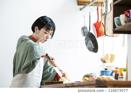Woman cooking in the kitchen 116673077