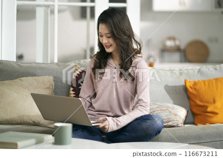 young asian professional woman working at home 116673211