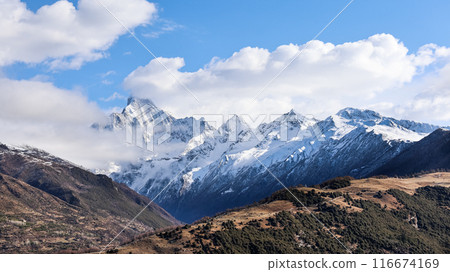 Panoramic view of Mount Siguniang or four sisters mountain featuring the four peaks with Yaomei feng the tallest 116674169