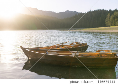 View of the Black Lake or Crno jezero , northern Montenegro. Tourist boats near wooden pier on Black lake in Durmitor national park near Zabljak, Europe 116675143