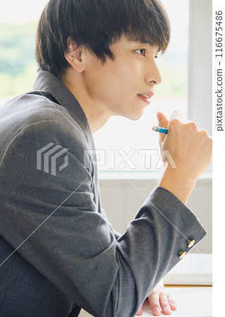 Boys studying to study 116675486