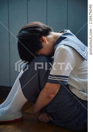 Depressed schoolgirl 116676046