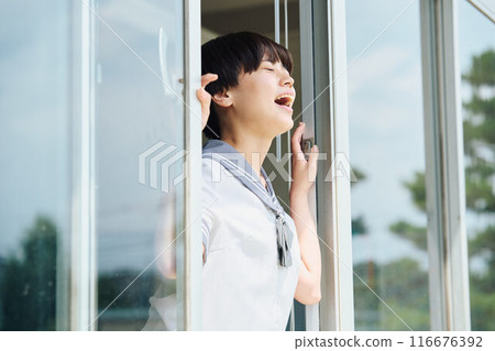 High school girls cheering from the window 116676392