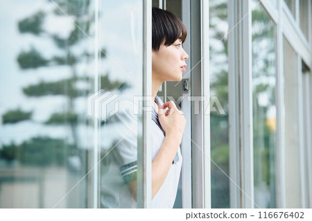 High school girls cheering from the window High school girls cheering from the window 116676402