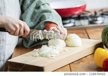Woman cooking in the kitchen Woman cooking in the kitchen 116676483