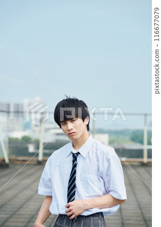 High school boy on the roof High school boy on the roof 116677079