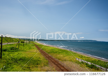 View of the coastline towards Abashiri and the Sea of Okhotsk from the observation deck at Kitahama Station on the Senmo Main Line 116677126