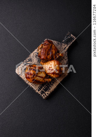 Delicious grilled chicken legs with spices and herbs 116677284