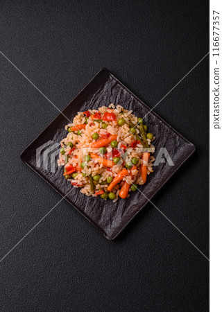 Delicious boiled rice with vegetables carrots, peas and peppers Delicious boiled rice with vegetables carrots, peas and peppers 116677357