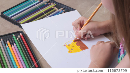 School girl draws cat with colored pencils. Art creativity and hobby. Childhood and activities at home. 116678799