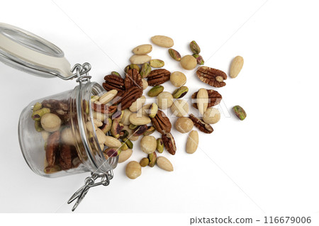 mix of peeled nuts in glass jar isolated on white 116679006