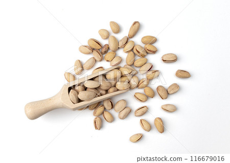 wooden scoop of pistachio isolated on white wooden scoop of pistachio isolated on white 116679016