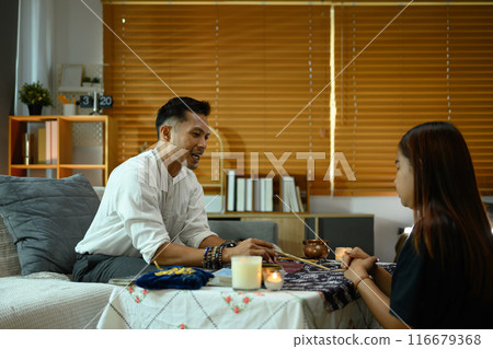 Fortune teller reading future on tarot cards for female client. Forecasting and divination concept 116679368