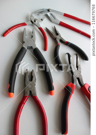 Vertical Stock Photo Of Slip Joint Pliers, Groove Pliers, Needle Nose Pliers And Linesman Pliers With Opened Jaws  116679768