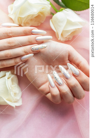 Female Hands with beautiful pearl manicure Female Hands with beautiful pearl manicure 116680014