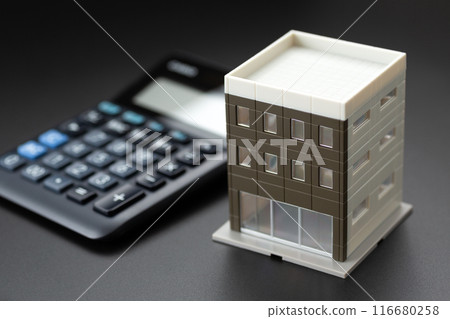 Office building and black calculator Office building and black calculator 116680258