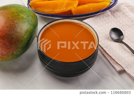Sweet mango puree in the bowl 116680803