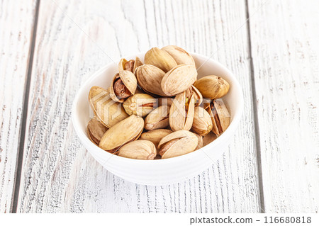 Salted tasty pistachio nuts heap Salted tasty pistachio nuts heap 116680818
