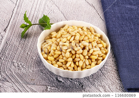 Peeled cedar nut in the bowl Peeled cedar nut in the bowl 116680869