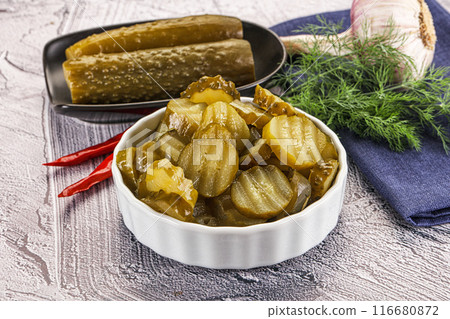 Sliced marinated cucumbers in the bowl Sliced marinated cucumbers in the bowl 116680872