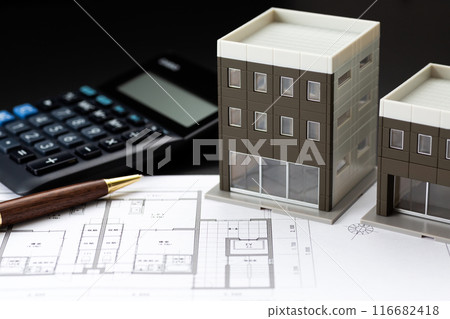 Image of real estate purchase (house blueprint, calculator and building model) 116682418