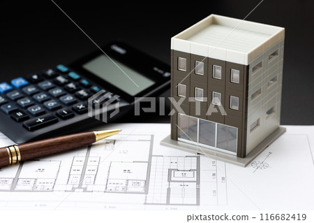 Image of real estate purchase (house blueprint, calculator and building model) Image of real estate purchase (house blueprint, calculator and building model) 116682419