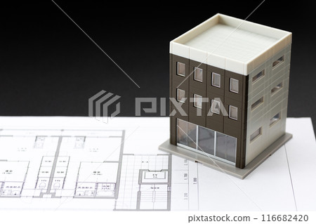 Image of real estate purchase (house blueprint, calculator and building model) Image of real estate purchase (house blueprint, calculator and building model) 116682420