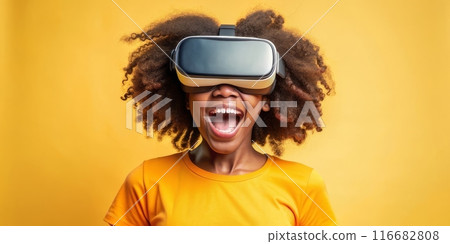 Teenager black girl experiencing virtual reality with joyful expression 116682808