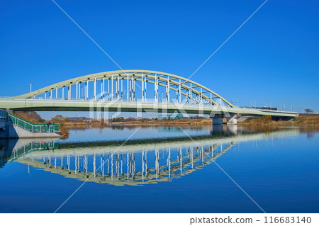 View of the Tama Aqueduct reflected on the Tama River from near Inada Tamagawa Park in Tama Ward, Kawasaki City 116683140