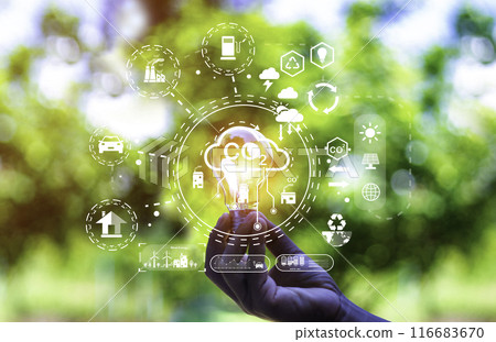 green energy concept help reduce global warming..Hand holding natural background light bulb on green leaf with clean energy icon around it. Carbon dioxide emission in industry zero carbon concept.. green energy concept help reduce global warming..Hand holding natural background light bulb on green leaf with clean energy icon around it. Carbon dioxide emission in industry zero carbon concept.. 116683670