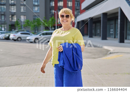 Portrait happy mature woman 50 years old outdoor, urban background 116684404