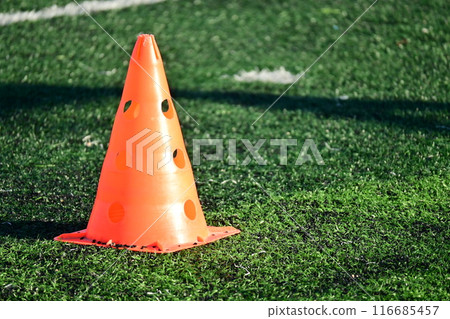 artificial green grass soccer field with orange training cones artificial green grass soccer field with orange training cones 116685457