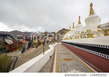 Buddhist Stupas And Prayer Flags At Thiksey Monastery In Ladakh, India. Buddhist Stupas And Prayer Flags At Thiksey Monastery In Ladakh, India. 116685859
