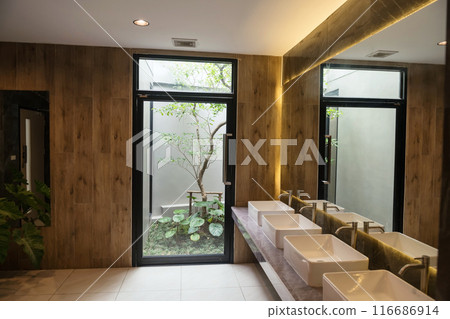 Interior design with sinks, toilet, and door to outside tree, bathroom Interior design with sinks, toilet, and door to outside tree, bathroom 116686914