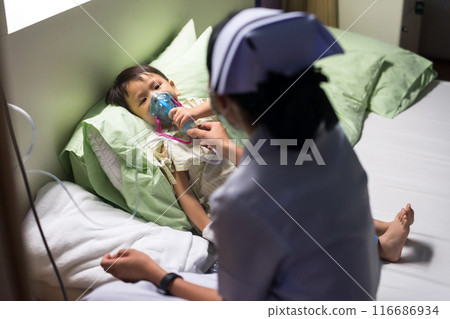 Nurse offer oxygen mask of inhaler to admitted patient boy in hospital 116686934
