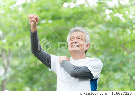 Senior man stretching, fresh greenery 116687226