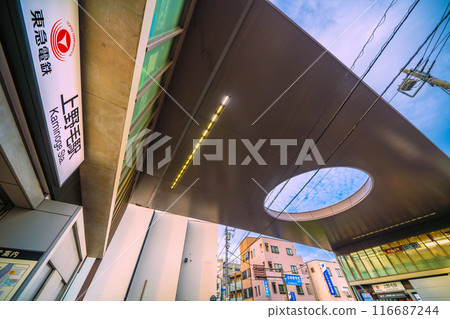 Tokyo cityscape in Japan: Tokyu Oimachi Line, Kaminoge Station, north exit (left) and main entrance (back right) seen on July 19th 116687244