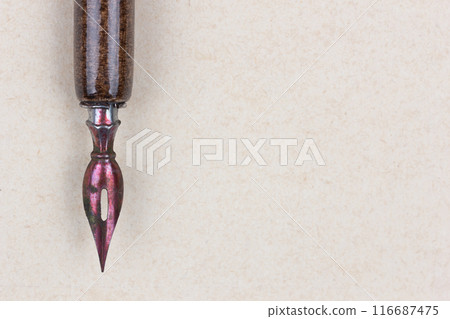 Fountain pen on an antique textured paper. Fountain pen on an antique textured paper. 116687475