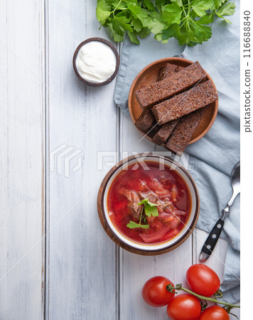 Traditional Ukrainian Russian borsch (beetroot soup) with meat in a black bowl Traditional Ukrainian Russian borsch (beetroot soup) with meat in a black bowl 116688840