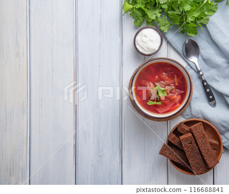 Ukrainian Russian borsch (beetroot soup) with meat in a black bowl  116688841