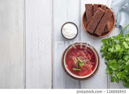 Traditional Ukrainian Russian borsch (beetroot soup) with meat in a black bowl Traditional Ukrainian Russian borsch (beetroot soup) with meat in a black bowl 116688843