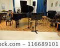 A music room where many children sang and played instruments 116689101